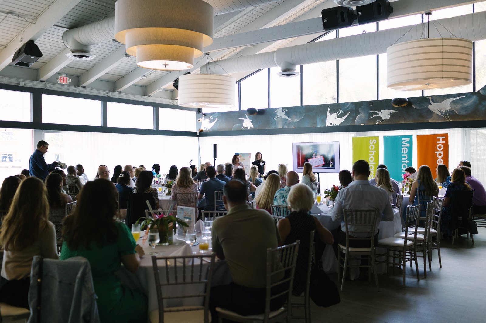 An audience listening at a Take Stock in Children of Broward event