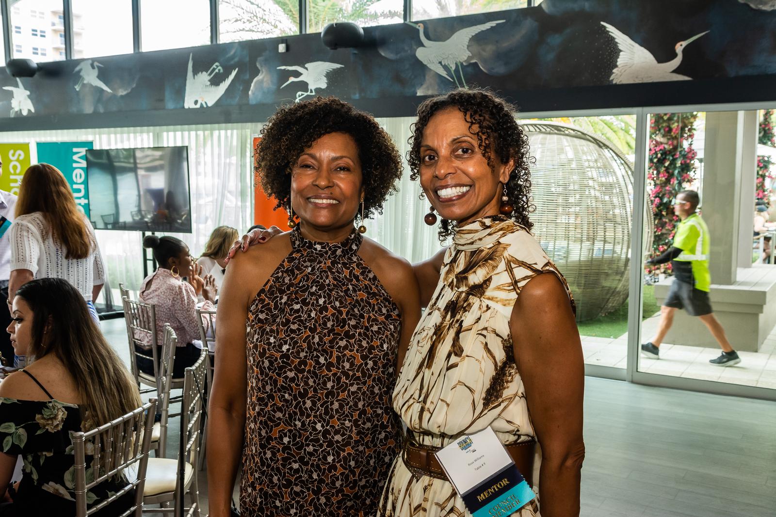 Two supporters smiling together at a Take Stock in Children event
